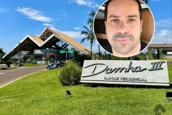 Fachada de um condomínio residencial de luxo com portaria, em dia ensolarado.