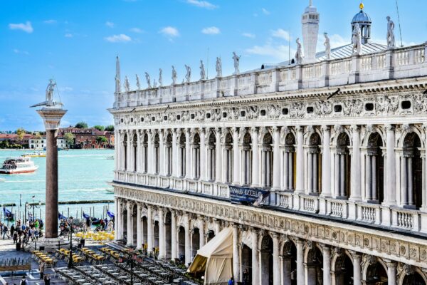 STF Define Marco Temporal para Demarcação de Terras Indígenas View of Biblioteca Marciana in Venice beside the Grand Canal, showcasing stunning architecture on a sunny day.